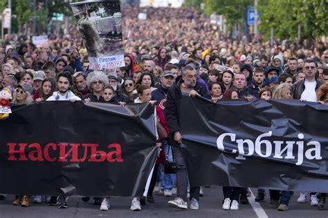 Tens of thousands march against Serbia’s populist leadership following mass shootings
